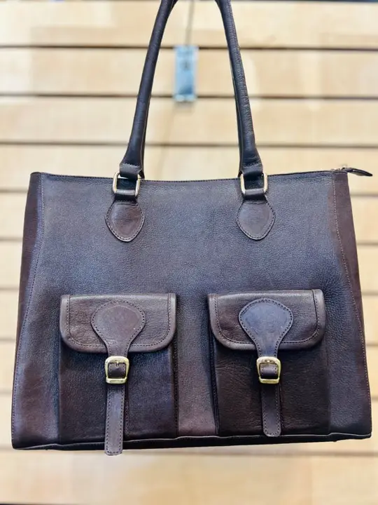 Brown leather tote with two buckled front pockets