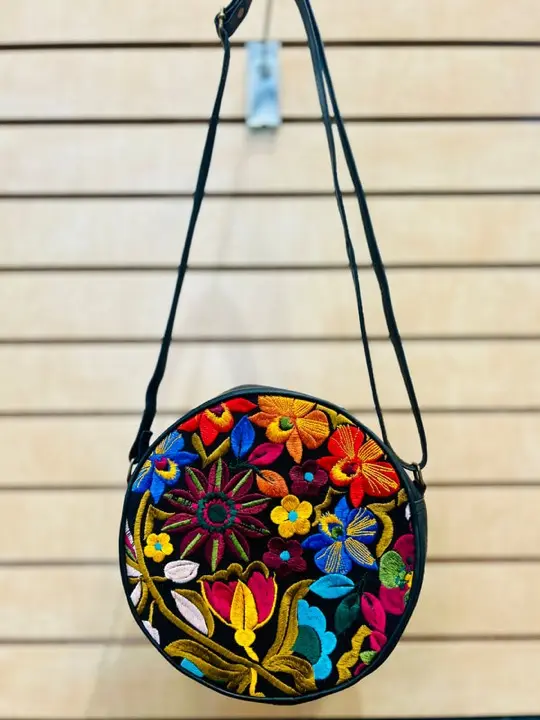 Round leather crossbody bag with colourful embroidered flowers