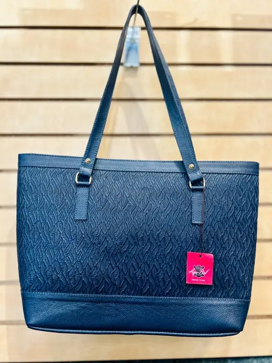 Navy embossed leather tote bag with tassel